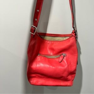 Peach coach cross body satchel.